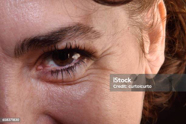 Detail Of Wrinkles In A Womans Eyes Stock Photo - Download Image Now - Wrinkled, Eyelash, Mature Women
