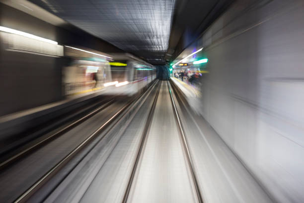 Blurred motion subway moving into tunnel, abstract background