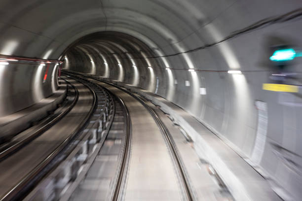 istock Blurred motion subway moving into tunnel, abstract background 658374490