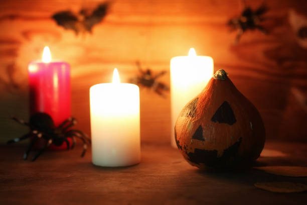 istock table decorations for Halloween carved pumpkin head candles 658381664