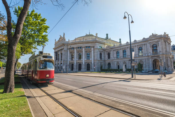 Tram and Burgtheater, Vienna, Austria Tram and Burgtheater, Vienna, Austria burgtheater vienna stock pictures, royalty-free photos & images