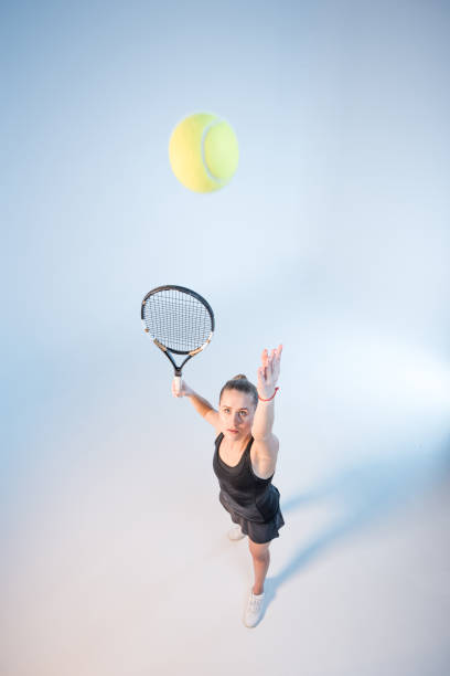 istock woman with tennis racket 658391926