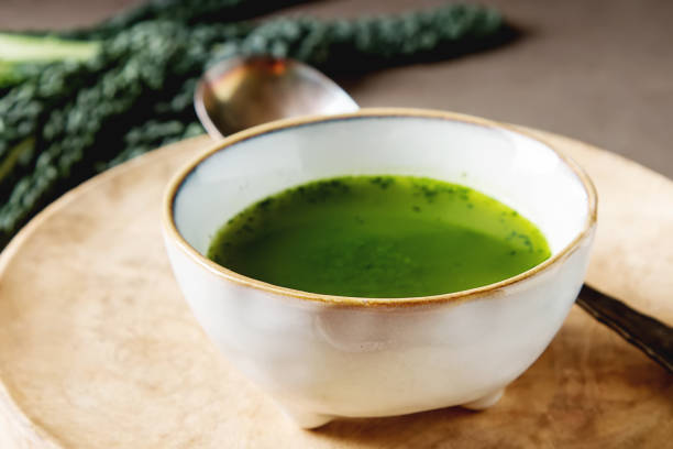 istock Green Italian soup made from cabbage kale in a white plate. Dark 658391994
