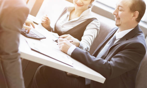 istock Image of human hand pointing at touchscreen in working environment at meeting 658392052
