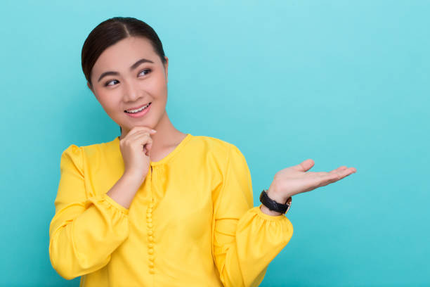 istock Asian woman show the copy space 658396434