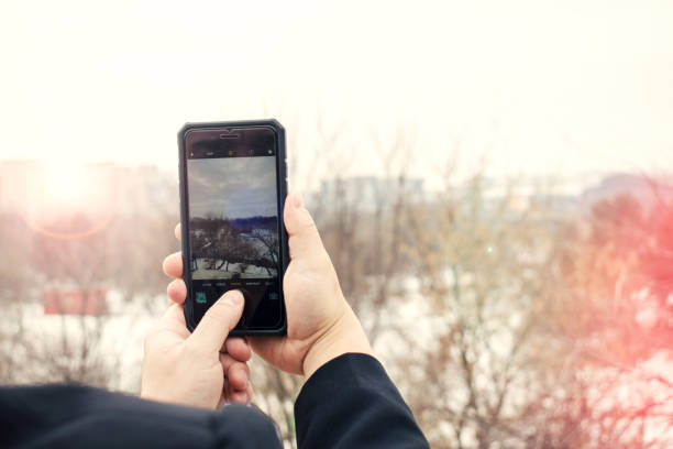 istock Businessman taking a picture with smartphone 658396476