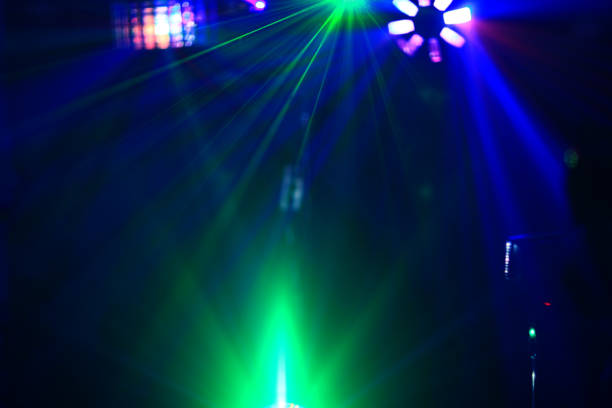istock Lighting disco with bright beams of searchlight and laser show 658396576
