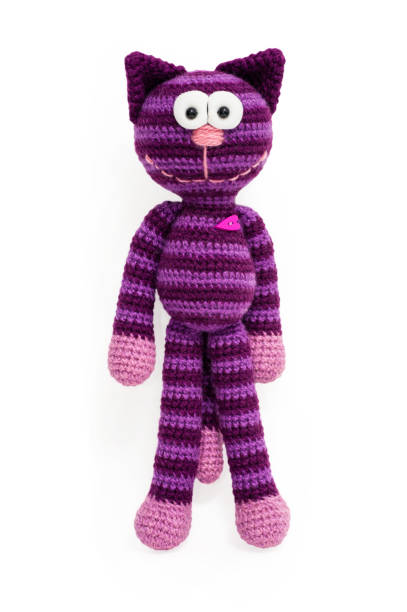 istock Knitted toy - striped sitting cat. 658396670