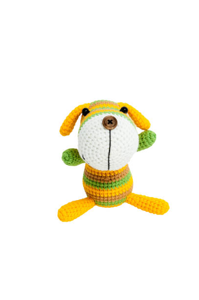istock Knitted toy - striped sitting dog. 658396680