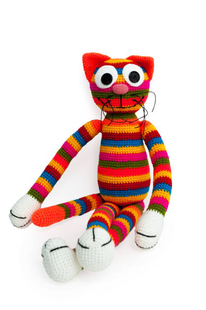 istock Knitted toy - striped sitting cat. 658396698