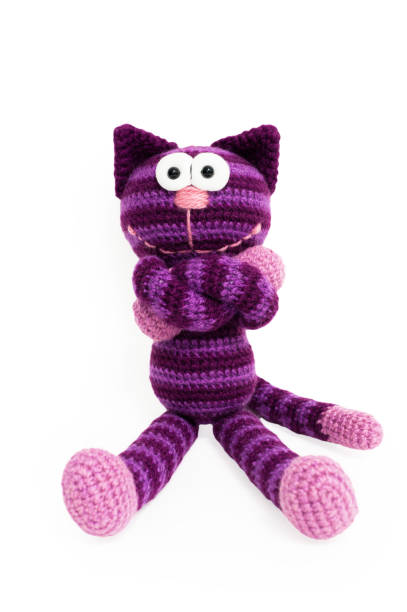 istock Knitted toy - striped sitting cat. 658396728