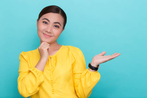istock Asian woman show the copy space 658397044