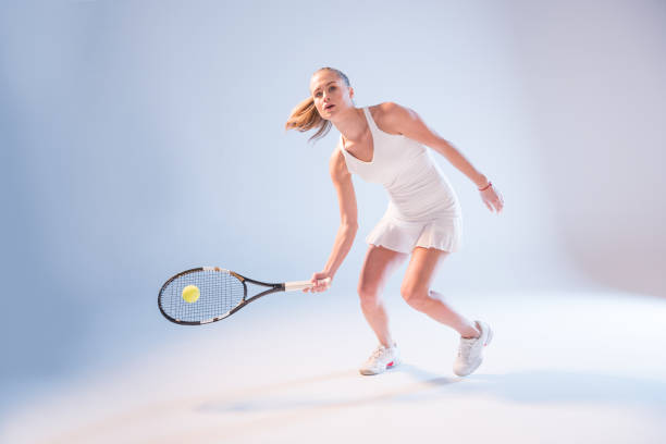 istock Young woman playing tennis 658397476