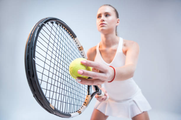 istock Young woman playing tennis 658397782