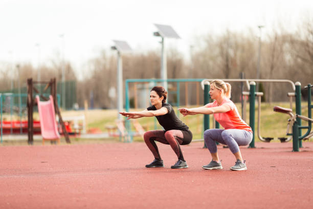 istock Squats.Two sporty women 658404430
