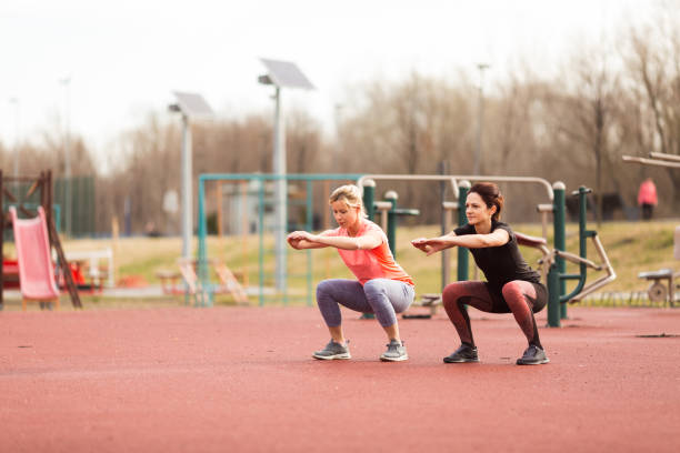 istock Squats. Two sporty women 658404710