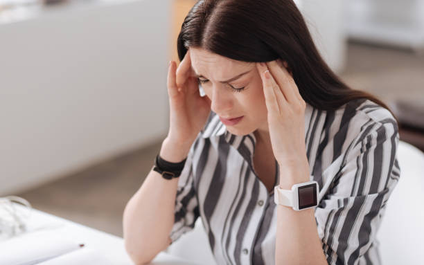 istock Inactive young woman having terrible headache 658408782