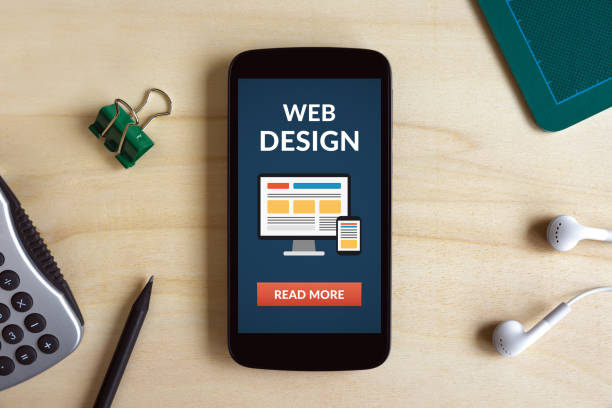 istock Web design concept on smart phone screen on wooden desk 658412414