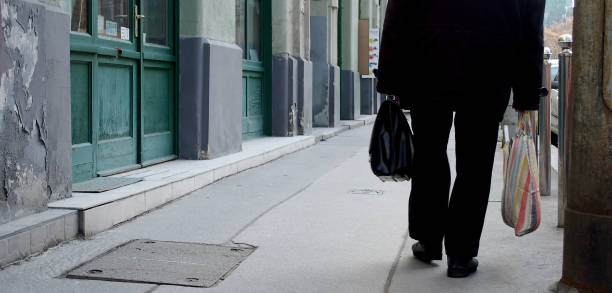 istock Man walking with suitcase on street 658413002