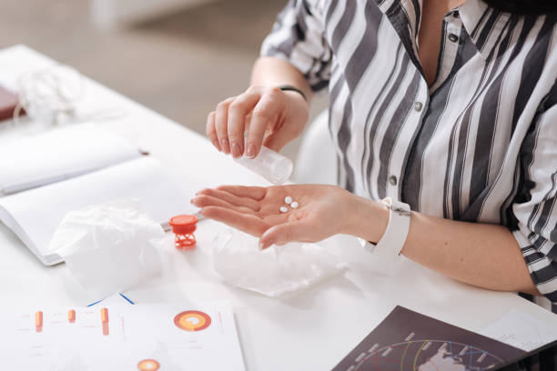 istock Close up of female hand lying on the workplace 658413984