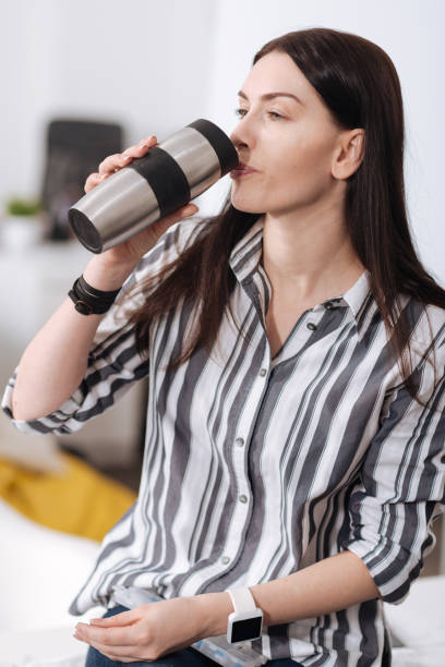 istock Portrait of confident girl while washing down tablet 658419004