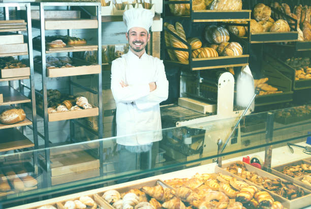 istock Young man is offering fresh tasty bun 658421790