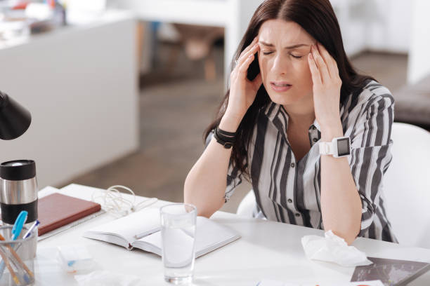 istock Young woman having terrible headache 658422266