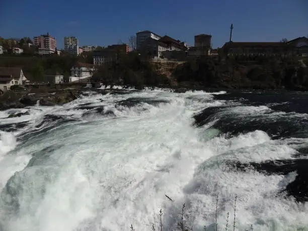 Photo of Rhine falls in summer with blue sky in Schaffhausen in Germany