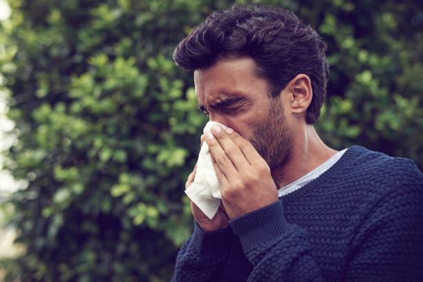 It's the season of sneezes Cropped shot of a young man suffering with allergies cold virus stock pictures, royalty-free photos & images