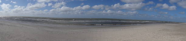 istock Beach panorama with blue sky and clouds near Klim in Denmark 658422922