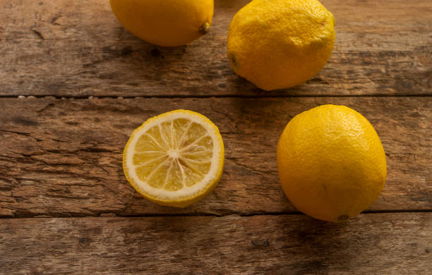 istock fresh lemon cut on wooden background 658424658