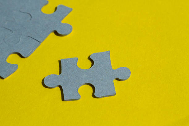 istock Jigsaw Puzzle pieces on yellow background 658429946