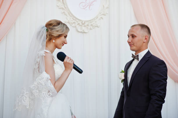 istock Bride speech, talking with microphone for her groom at wedding ceremony. 658431374