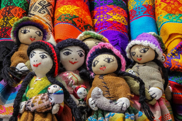 istock Different colorful fabric and souvenir dolls at a market 658435680