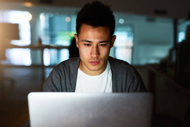 istock Putting in the hours to meet his deadline 658436842