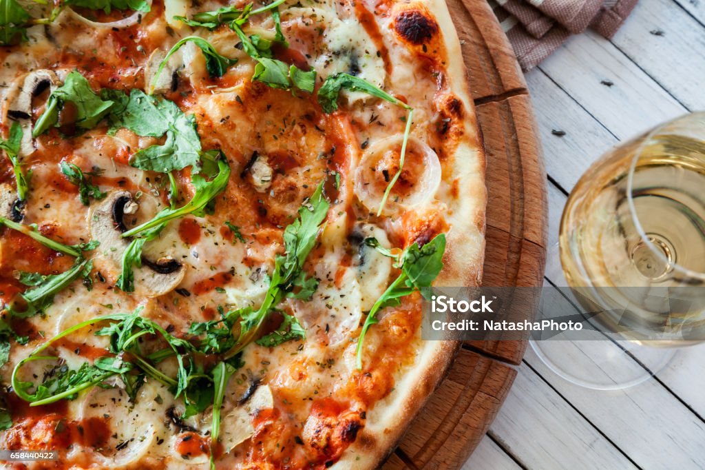 Pizza Delicious Pizza On Wooden Board With Wine Glass Beside Pizza Stock Photo