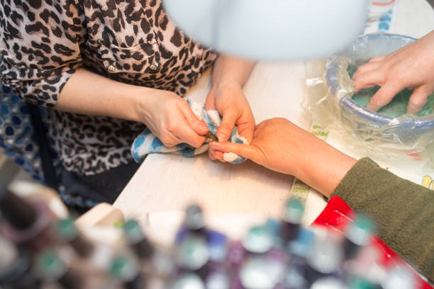 istock Female manicure on hands in a beauty salon 658440682