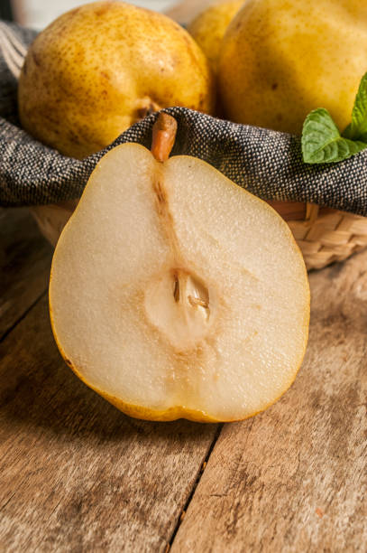 istock fresh ripe organic pears on a rustic wooden table close up 658442958