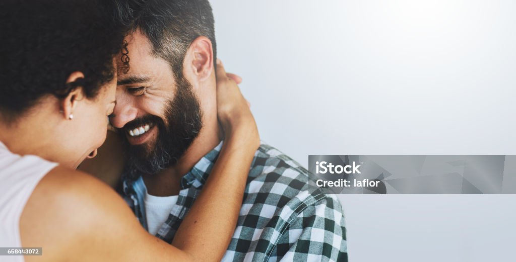 They fall in love a little more every day Shot of a happy couple sharing an affectionate moment together at home Couple - Relationship Stock Photo