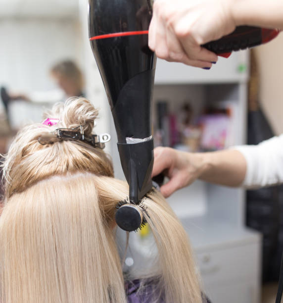 istock Styling female hair dryer 658443342