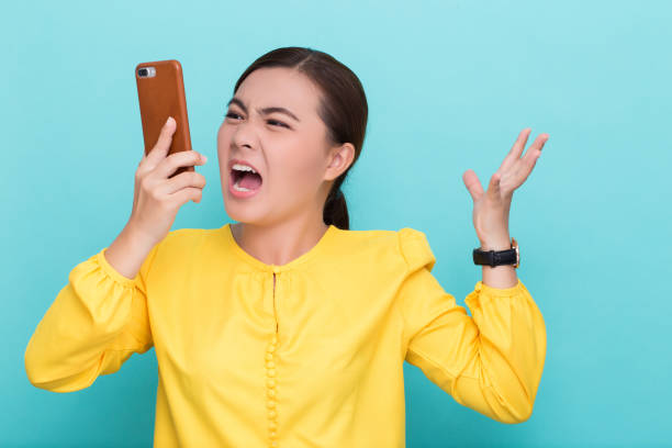 istock Woman calling the smartphone and she feel angry 658447430