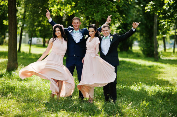 istock Best man's with bridesmaids on wedding at park. 658447512