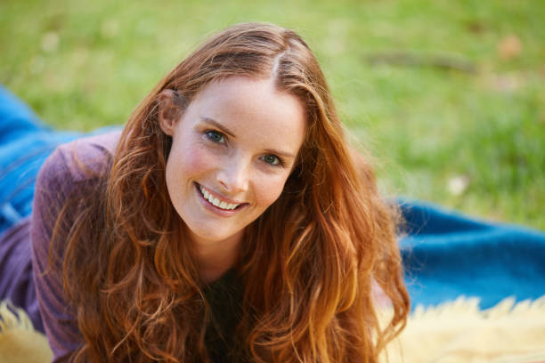 Shot of a young woman relaxing at the park