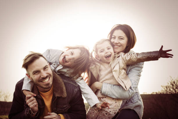 Happy African-American family with two children on beach