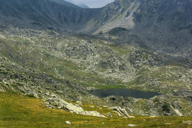 istock Dark clouds over Spanopolski chukar peak, Pirin Mountain 658451746