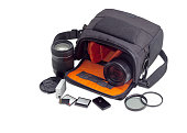 Open camera bag, photo lenses and some photo accessories