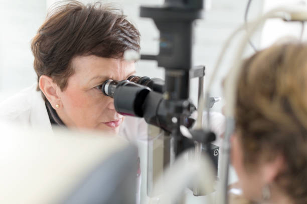 istock Woman having eye examination 658455112