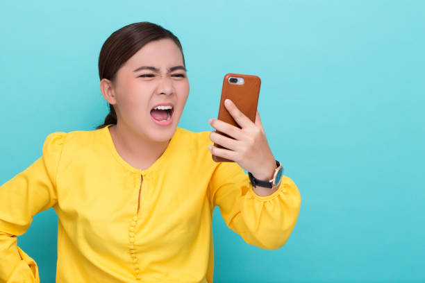 istock Woman shouting to the smartphone 658455822
