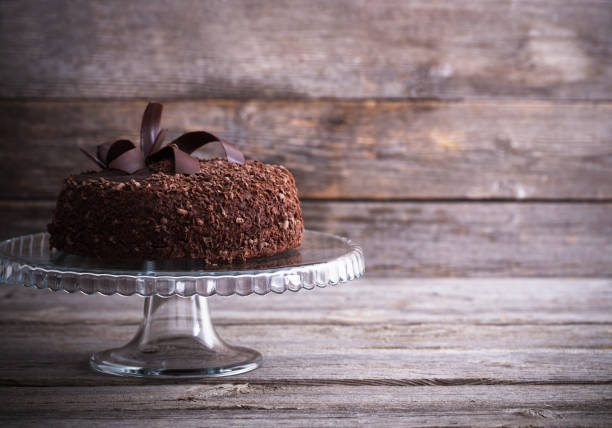 istock Chocolate cake on old wooden table 658455966