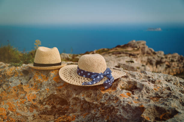 romantic vacation in nature - two hats on vacation in mountains